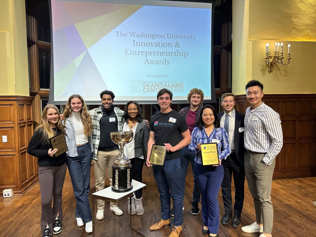 The winners of the Skandalaris Venture Competition, Including Clay Canfield (Sobriety Hub Founder) holding the First Place Trophy